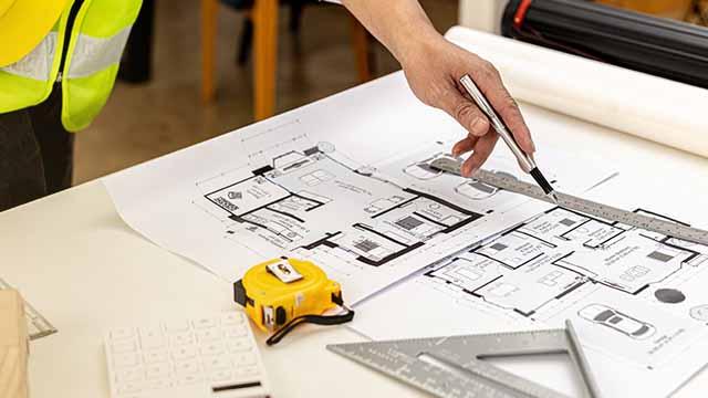 interior designer presenting 3d floor plan to a client